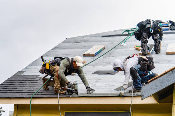 Professional Roofing technician working in West Medford, MA
